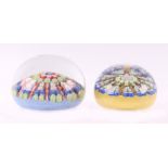 A Perthshire millefiori type paperweight and another similar (2).