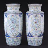 A pair of Victorian glass vases with tube line decoration, 22cm high