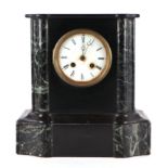 A Victorian black slate and figured green marble mantel clock, the white enamel dial with Roman