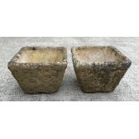 A pair of reconstituted stone square planters, each 36cm wide (2).