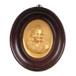 An 18th century gilt gesso relief oval bust portrait depicting the Head of Christ, with paper