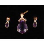 A 14ct gold amethyst and diamond set suite, comprising of pendant and matching earrings