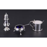 A modern silver George III style three piece cruet set comprising a cauldron salt with blue glass