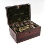 A George III coromandel dressing box retailed by T Briggs, the fitted interior with an assortment of