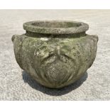A reconstituted stone planter decorated with roundels, 36cm diameter.