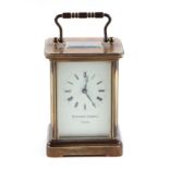 A four pillar brass carriage clock, the white enamel dial with Roman numerals, signed 'Matthew