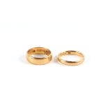 Two 22ct gold wedding bands, 9.7g (2).Condition ReportThe rings are size M and L.