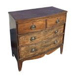 A Regency mahogany bowfront chest of drawers of small proportion, with two short and two graduated