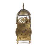 A 17th century brass lantern clock, the dial with Roman numerals, (17th century case with later