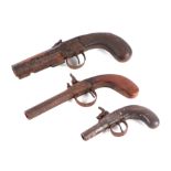 A 19th century percussion muff pistol and two similar larger examples (3) (a/f).