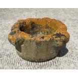 A well weathered reconstituted stone mortar, 40cm diameter.