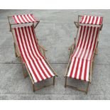 A pair of traditional canvas deckchairs with matching foot stools (4).Condition ReportGeneral