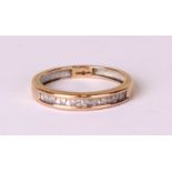 A 9ct gold moissanite set half eternity ring, approx UK size 'J', 1.5g.