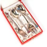 A set of four Danish silver forks and spoons, two with blue enamel crown finials and two with red