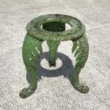 A Victorian cast iron jardinière stand with leaf capped cabriole legs terminating in pad feet,
