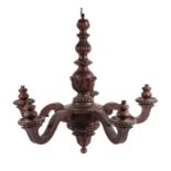 A carved and stained wood five branch chandelier. Approx. 63cm wide