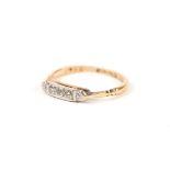 An 18ct gold three stone diamond ring, Approx UK size J, 1.6g