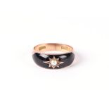 A 9ct gold gypsy style pearl and black enamel ring, approximately uk size N, 2.8g.