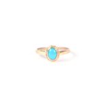 A 9ct gold ring set with a turquoise cabochon, approx UK size P, 1.7g.