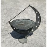 A bronzed metal sun dial on stand, 23cm diameter.