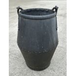 A large riveted well bucket, 65cms high.