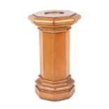 A satin birch and pine display stand on octagonal column, 41cm wide, 74cm high.