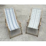 A pair of traditional canvas deck chairs.