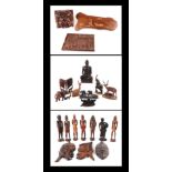 A large quantity of Asian and ethnographic wooden carvings depicting animals, figure and panels.