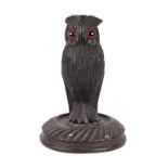 A Victorian Irish bog oak figure in the form of an owl, 16cms high.