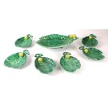 A continental majolica leaf shaped desert set with applied apple decoration, the serving dish