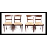 A set of four Willian IV mahogany dining chairs, having drop in seats and reeded tapering legs. (4)