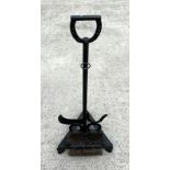An iron boot scraper with horseshoe handle, 96cms high.