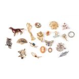 A quantity of costume jewellery brooches.