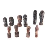 An African carved hardwood bust of a young lady, 21cm high; and other similar hardwood figures (