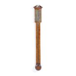 A George III mahogany stick barometer by J. Rawes, Sherborne, with a brass register plate and