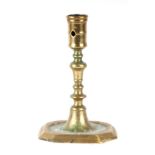 A 17th century brass candlestick, 15cms high. Condition Report Slightly tarnished, no major knocks