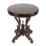 A mahogany occasional table on quatrefoil supports, 60cm diameter.