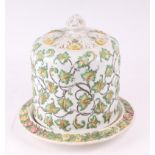 A Victorian pottery Stilton dome decorated in relief with scrolling foliage, 32cms high.