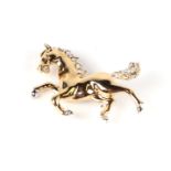 A Suzanne Bjontegard (BJ) costume jewellery horse brooch with pave set crystal mane and tail, 5cms