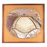 A late 1960s / early 70s Studio Pottery plaque depicting an abstract town scene, framed, 41cm wide.