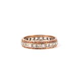 A 9ct gold and white stone eternity ring, 3.6g, approx UK size 'Q'.