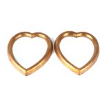 A pair of gilt framed heart shaped wall mirrors, each 20 by 24cms overall (2).