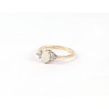 A 9ct gold opal and diamond ring, Approx UK size P. 1.9g