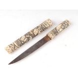 A late 19th century carved bone Japanese Tanto dagger with 16cms (6.25ins) blade.