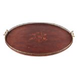 An inlaid mahogany two handled tray with pierced gallery, 68cms wide.