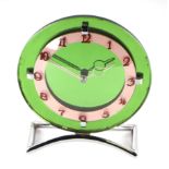 A Smiths Art Deco green glass and chrome mantle clock, having a silvered chapter ring with Arabic