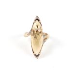 A 9ct gold dress ring set with a large citrine, approximately uk size N, 4.9g. Condition Report