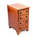 An Edwardian mahogany pedestal chest of small proportions with four drawers, on bracket feet,
