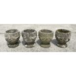 A set of four well weathered reconstituted stone urn form planters, 23cm diameter, (4)