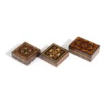Two Tunbridgeware tangram puzzle boxes including: a square rosewood example with a floral mosaic